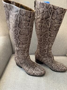 Børn Audriana tall boots featuring a distinctive brown snakeskin animal print